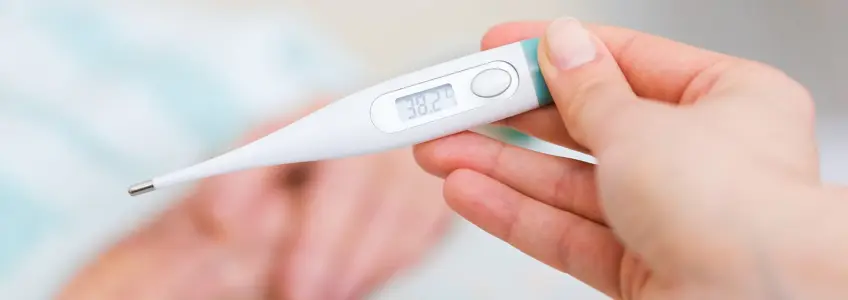 termómetro a indicar 38,2 de febre